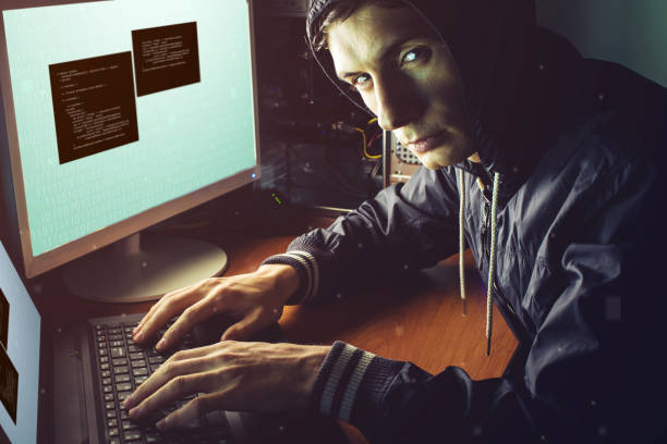 istock hacker in the dark breaks the access to steal information 815477674