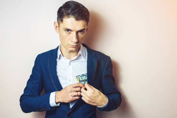 istock man businessman taking notes in pocket as a bribe 815477732