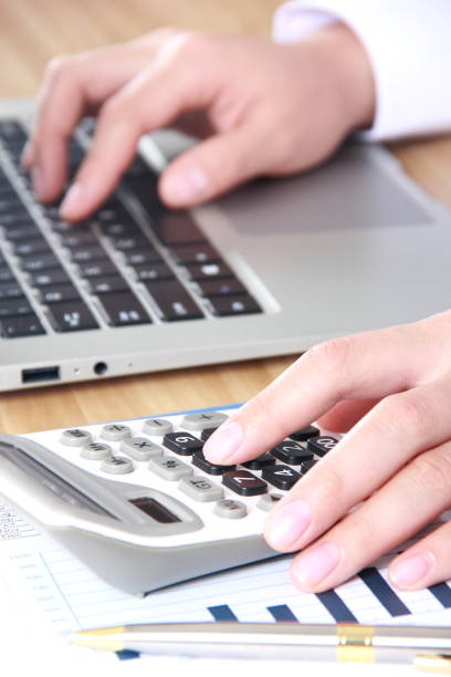 istock Business women working with calculator and laptop 815483248