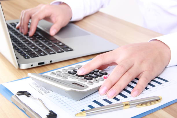 istock Business women working with calculator and laptop 815483252