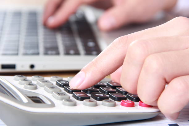 istock Business women working with calculator and laptop 815483308