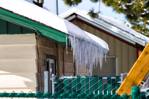 istock Icicle hanging from the side of the roof 815485206