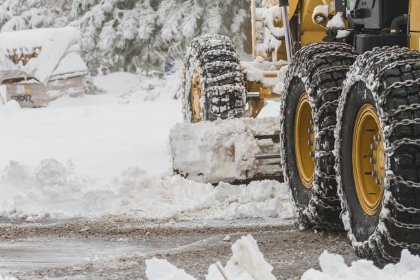 istock Tractor plowing snow from street 815485664