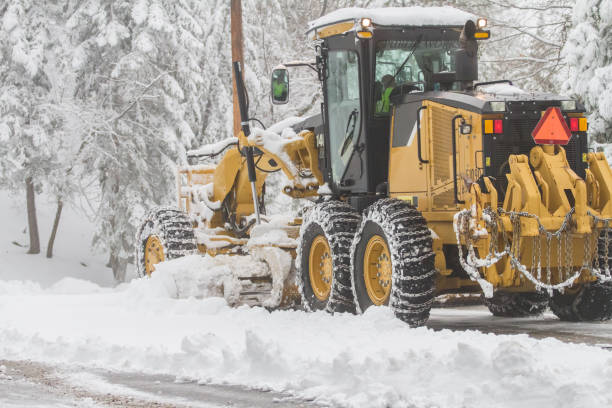 istock Tractor plowing snow from street 815486094