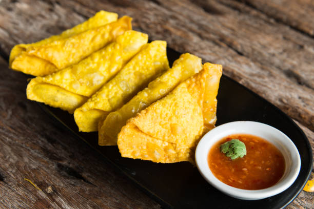 istock Deep Fried Wonton on plate wooden background 815501222