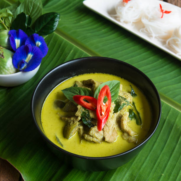 istock Green curry creamy coconut milk with chicken with thai rice noodle 815501418