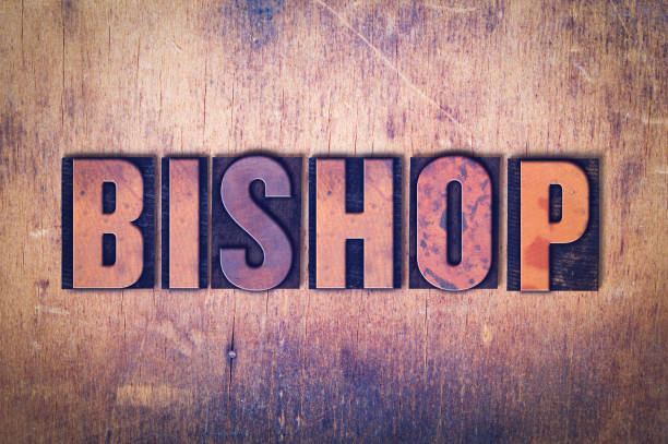 The word Bishop concept and theme written in vintage wooden letterpress type on a grunge background.