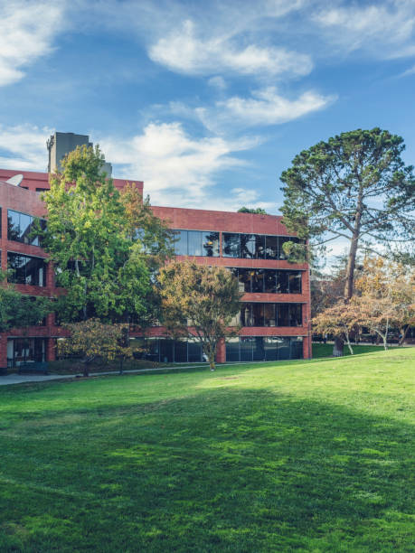 istock view of green lawn around modern office building 815528746