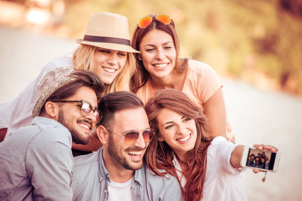 istock Friends having fun on the beach 815538114