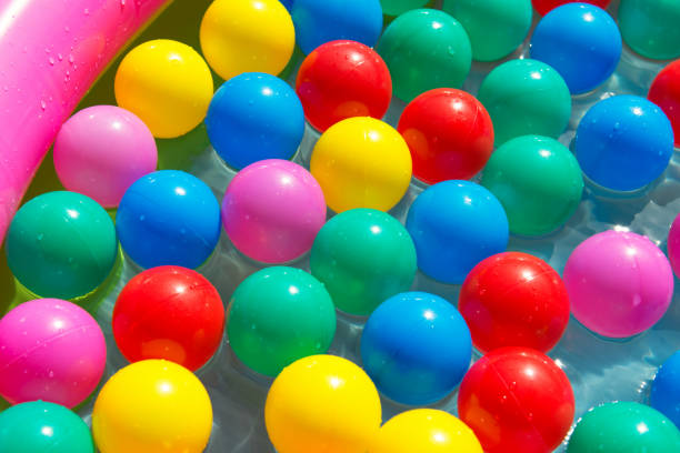 istock Colorful balls in the swimming pool, summer concept 815553220