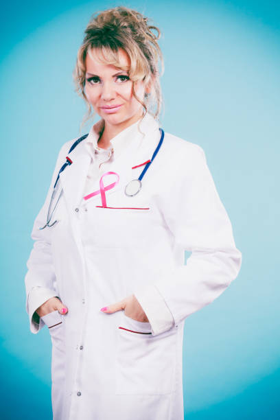 istock Doctor with pink cancer ribbon 815560486