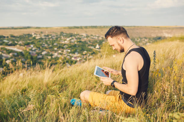 istock Young man smiling and enjoying sunny summer day 815565384