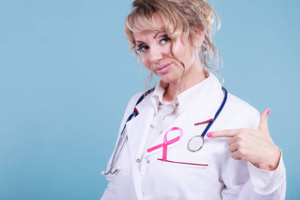 istock Doctor with pink cancer ribbon 815565830