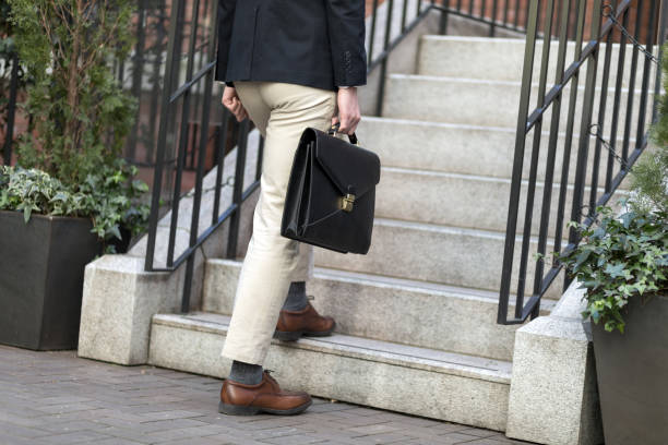 istock young man who climb the stairs 815570964