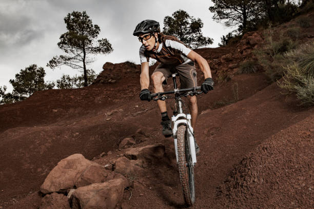 istock Young man riding mountain bike downhill 815576860
