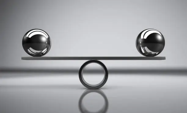 Business and lifestyle balance concept with balanced metal balls on grey background 3D illustration.