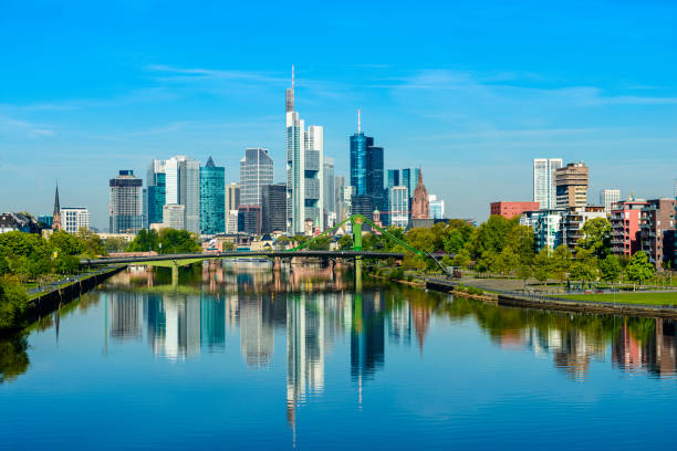 Frankfurt City skyline and Main river reflection on a clear day, Germany Reflections of the City Skyline in the still river. frankfurt skyline stock pictures, royalty-free photos & images