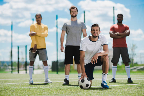 istock multiethnic soccer team standing on soccer pitch after game 815607080