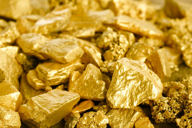 istock Close up lump of gold mine background texture 815612646