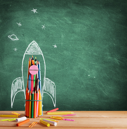 Start School Concept - Rocket Drawn On Blackboard