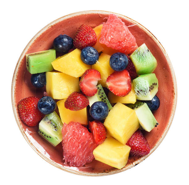 istock healthy fruit salad isolated on white background. Top view 815620012