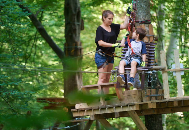 istock mother with her son in forest amusement park 815635166