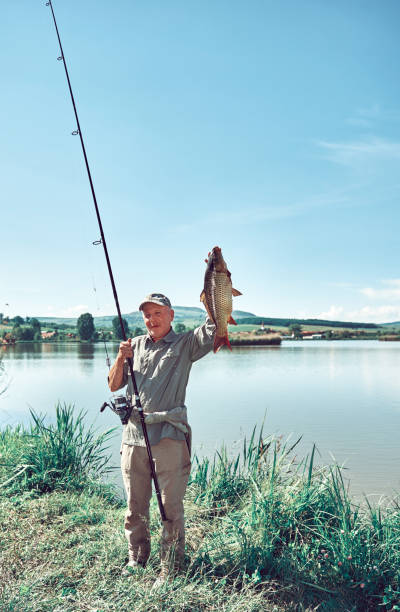 istock senior man proud of his capture 815635174