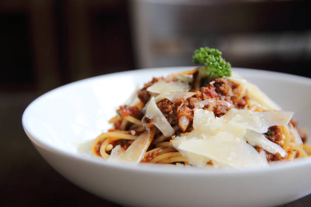 istock spaghetti bolognese meat sauce on wood 815635338