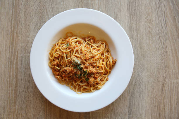 istock spaghetti bolognese meat sauce on wood 815635404