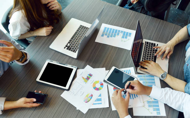 istock Technology equipment with tablet, laptop, business documents on meeting table 815636072