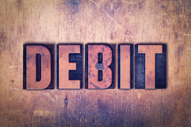 istock Debit Theme Letterpress Word on Wood Background 815636082