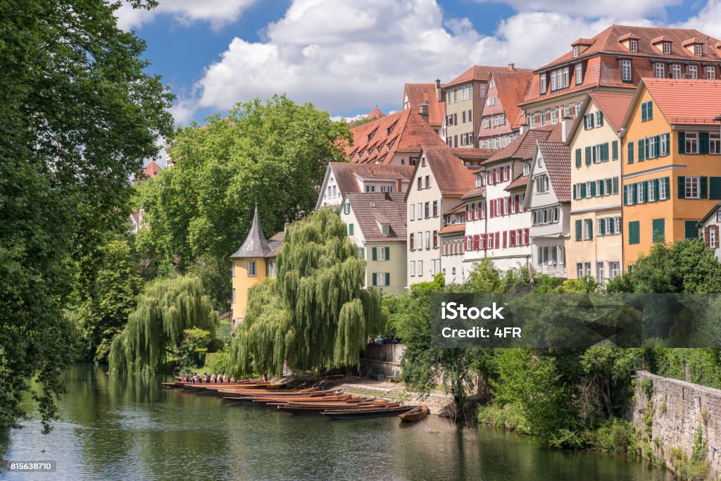 Tübingen, Germany The beautiful historical city Tübingen in Baden-Württemberg. You can see the famous Neckarinsel, Neckarbrücke, Hölderlinturm and one of the most famous house fronts in Germany. The typical Stocherkahn boats in back. Nikon D810. Converted from RAW. Unrecognizable people. Germany Stock Photo