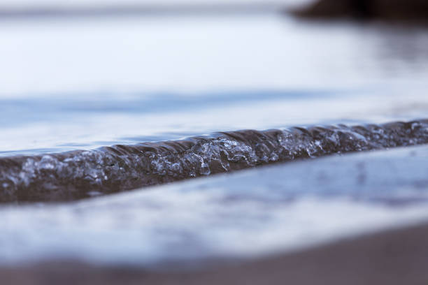 Splashing sea ripple on a beach shoreline