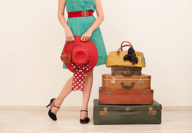 istock Woman Standing Beside Suitcases 815641944