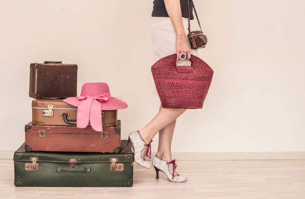 istock Woman Standing Beside Suitcases 815641978