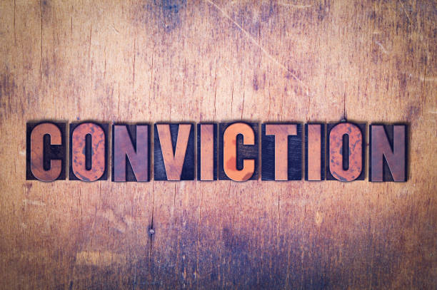 istock Conviction Theme Letterpress Word on Wood Background 815642996