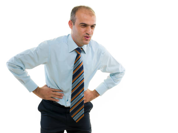 istock Young man clutching his abdominal in pain 815643324