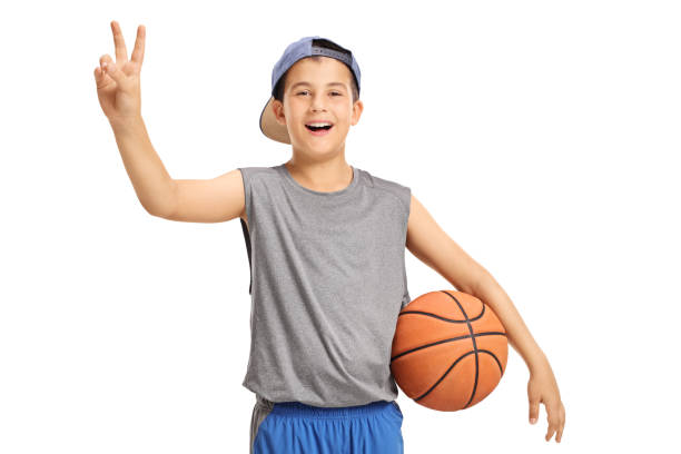 istock Happy kid with a basketball making a victory sign 815649452