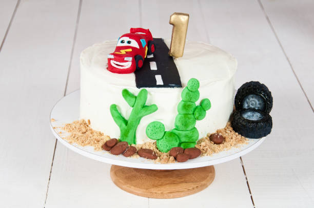 istock Festive cake with a birthday car for 1 year 815654704