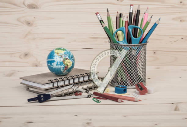 istock Back to school template with multiple stationery and books on table 815654734