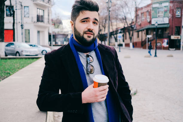 istock Handsome young man on a walk in town 815662852