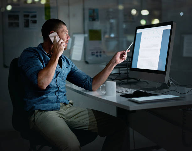 istock Staying late and keeping everyone up to date 815665336