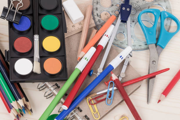 istock back to school template with multiple stationery on wooden table 815676840
