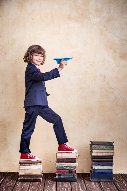 giovane uomo d'affari - book child staircase steps foto e immagini stock