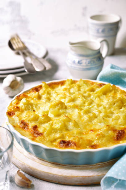 istock Cauliflower casserole with cheese and milk sauce 815677768