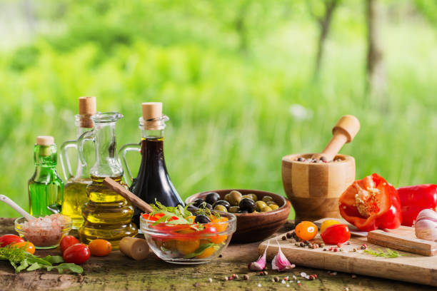 istock vegetables with oil on wooden table outdoor 815681146