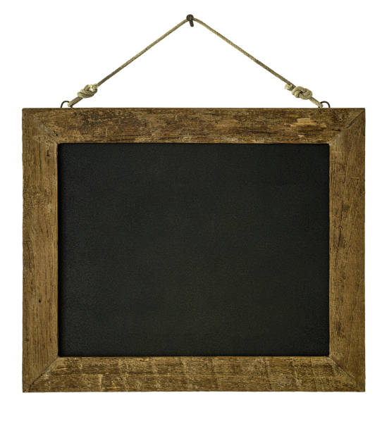 istock An old wooden framed blackboard hangs from a rusty nail, isolated on white, clipping path included. 815686092