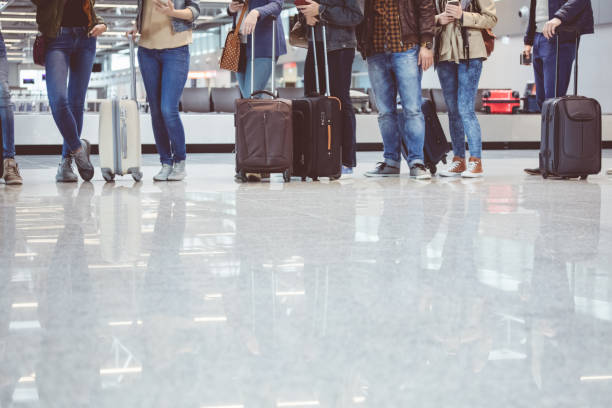 istock Passengers waiting at boarding gate at airport 815698420