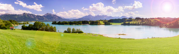 istock panorama landscape in Bavaria with meadow and alps mountains 815698486