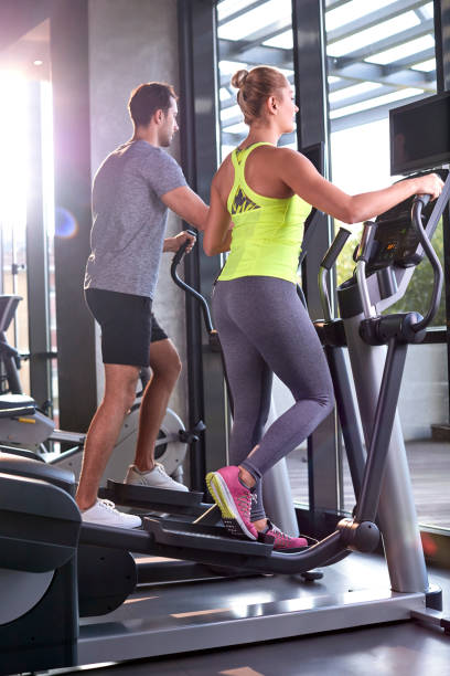 istock Healthy group of people working out on a elliptic trainer 815698746